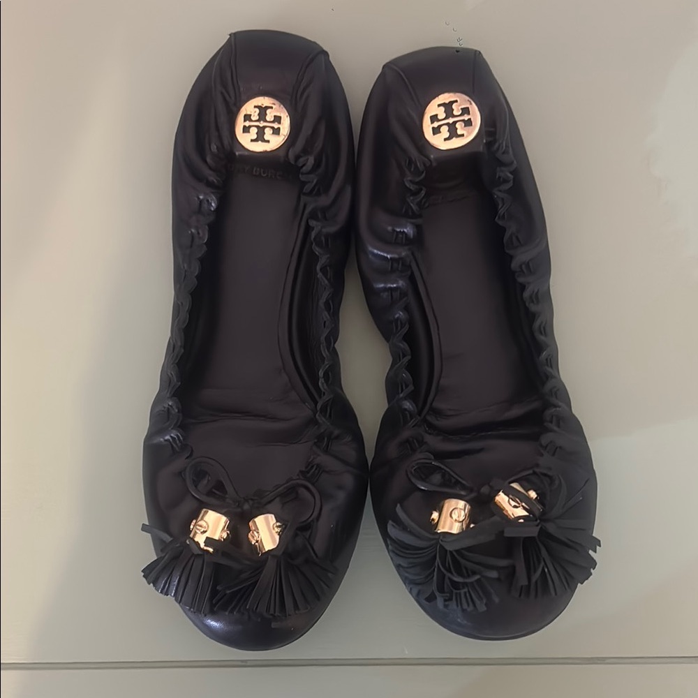 Tory Burch Black and Gold Flats with Logo Medallion